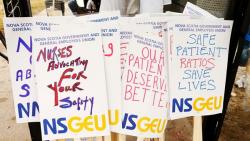 photo of picket signs saying Nurses Advocating for your Safety, NSGEU