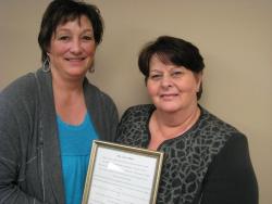 PEIUPSE President Debbie Bovyer presents Cathy MacKinnon her award in the Why Unions Matter contest.