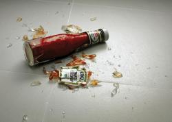 broken bottle of Heinz ketchup on the floor