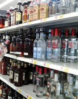 store shelf with liquor bottles on it