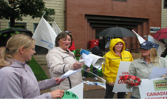 PEIUPSE President Debbie Bovyer with members on picket line of striking CBS workers