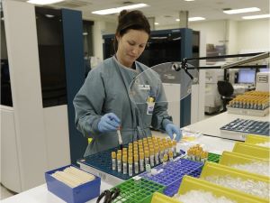 female lab tech sorting vials